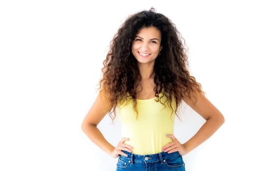 Beautiful smiling girl standing with hands on waist