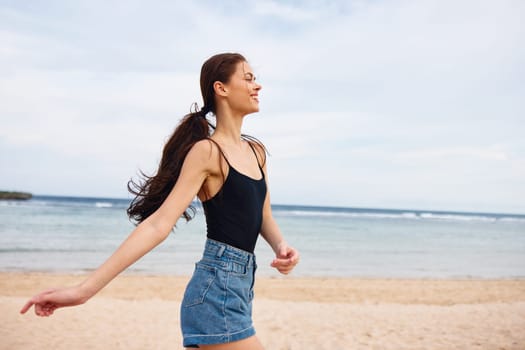 woman happiness carefree travel hair summer beach sunset sea ocean long hair sun flight young freedom fun walking lifestyle smile female running