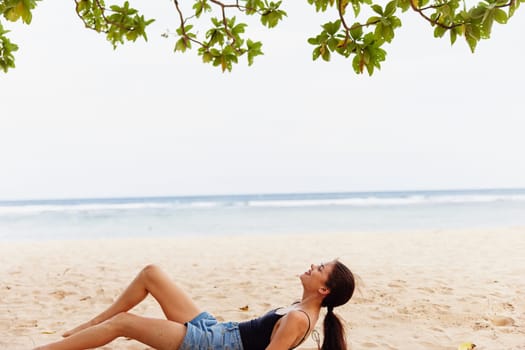 happy woman back vacation smile freedom model sand beach bali sea beautiful young beauty attractive nature travel person lifestyle view sitting ocean