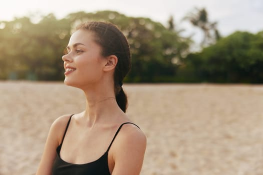 woman sunset walking sun ocean sunlight vacation water smile person happiness summer sea sand free beach lifestyle girl smiling sky nature