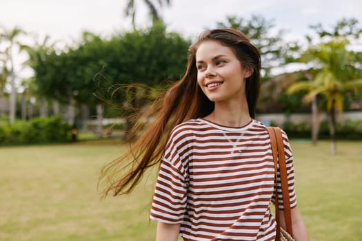 woman hair beautiful nature striped long quiet freedom summer hipster lifestyle walk grass t-shirt smiling fun exercise wellness park active meadow carefree