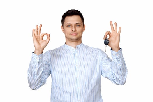 happy caucasian man holding car keys on white background. Car dealerships offer car .