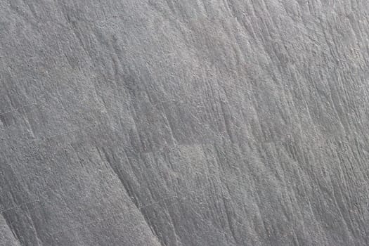 The texture of the stone in gray close-up.