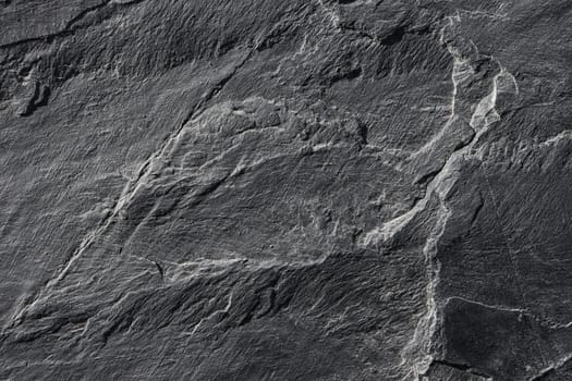 Texture of old gray granite on the wall.