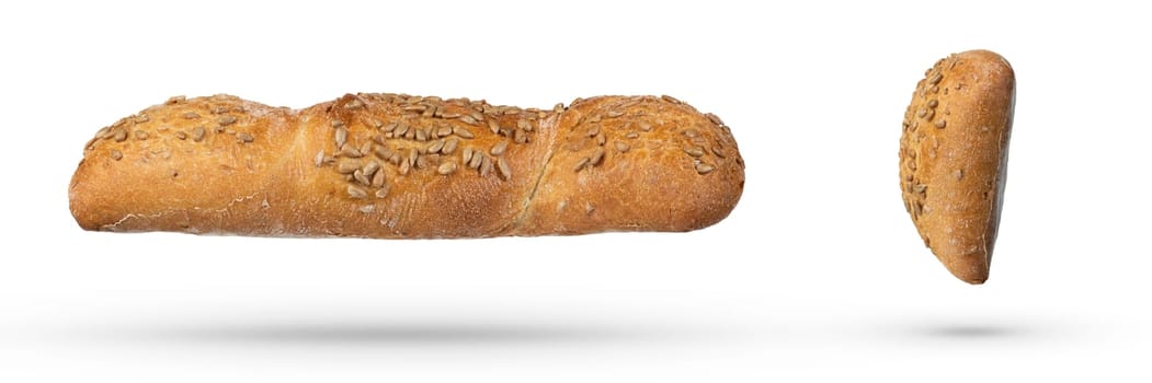 Homemade white bread isolate with seeds and whole grains. Side view of a loaf of fresh bread on a white isolated background. The concept of baking bread