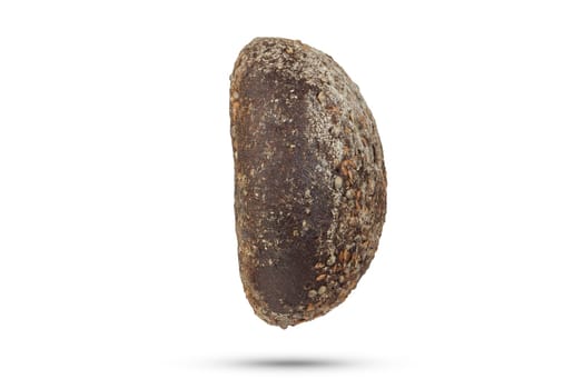 Black loaf of bread on a white isolated background. A loaf of black fresh bread with hemp seeds. Side view for insertion into a design or project. High quality photo