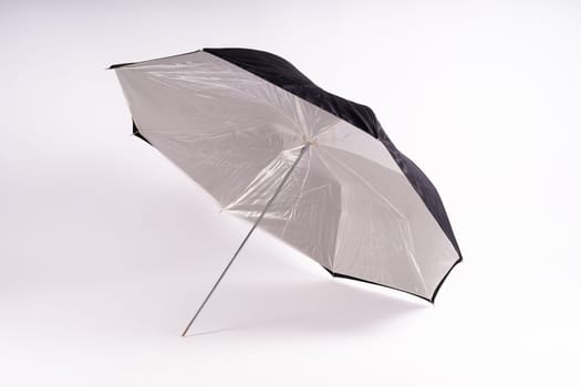 Photography studio light reflector isolated on white background umbrella