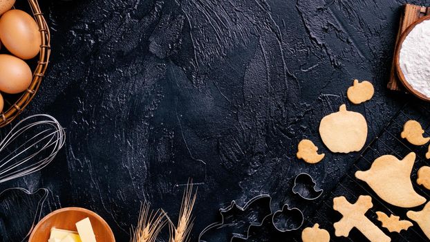 Design concept of making Halloween cookies, baking recipe ingredients layout of preparing party, top view, flat lay, overhead, blank copy space.