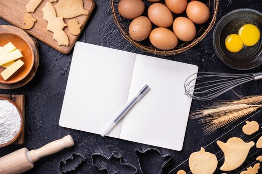 Making cookies cookbook recipe design concept, baking ingredients preparation layout with notebook, top view, flat lay, overhead, mockup copy space.