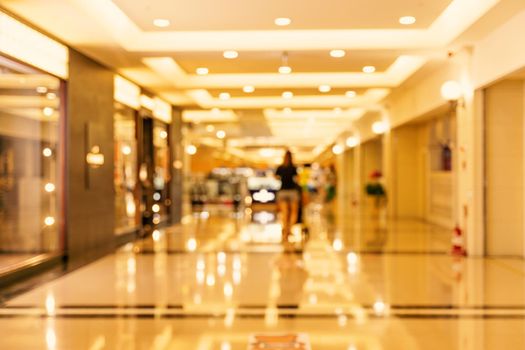 Luxury department store shopping mall interior, abstract defocused blur with bokeh background, concept of shopping seasons design.