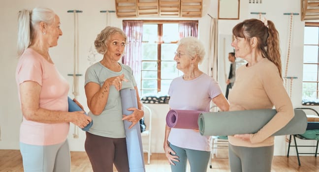 Yoga, friends and senior women talking about studio fitness training, pilates workout or retirement healthcare exercise. Group communication, team discussion and elderly people in gossip conversation.