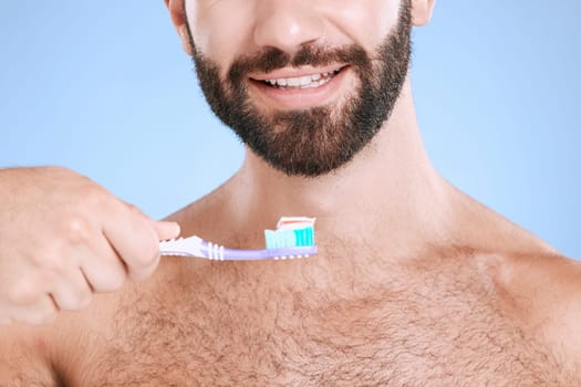Brushing teeth, studio face and man with toothbrush, dental wellness and healthy mouth care. Happy male model, oral cleaning and smile for fresh breath, facial happiness and toothpaste for cosmetics.