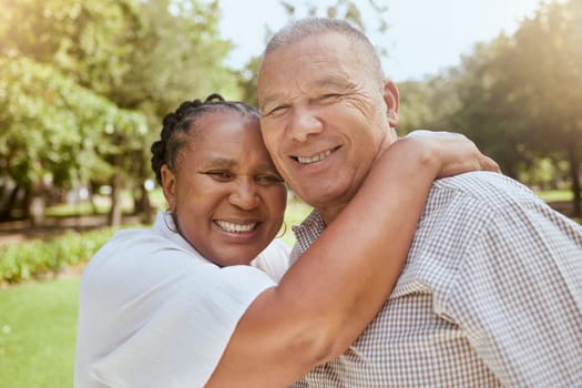 Senior, couple and portrait in a garden for love, caring and affection hug in nature for holiday. Vacation, loving and mature elderly or retired husband and wife embracing in a peaceful park.