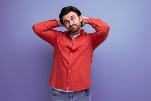 attractive brutal dark-haired 30s man in a red shirt.