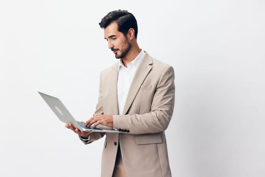 man beige working smiling isolated internet business young suit model stylish using freelancer male job computer laptop shirt copyspace smile entrepreneur