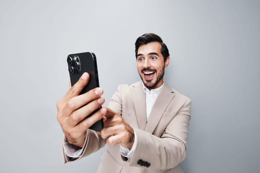 happy man internet business copy cell portrait suit smile background white male technology smartphone isolated hold call holding adult phone selfies space