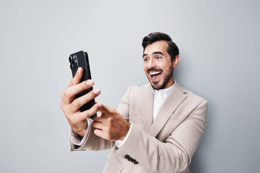 happy man person selfies hold young smile holding confident white phone cell mobile phone suit call portrait isolated male business internet smartphone