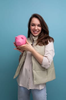 young brunette woman saved up money and decides where to spend it.