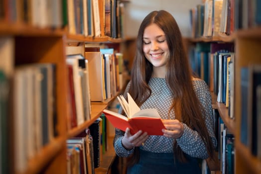 Happy young woman enjoys reading, concept of education und getting knowledge