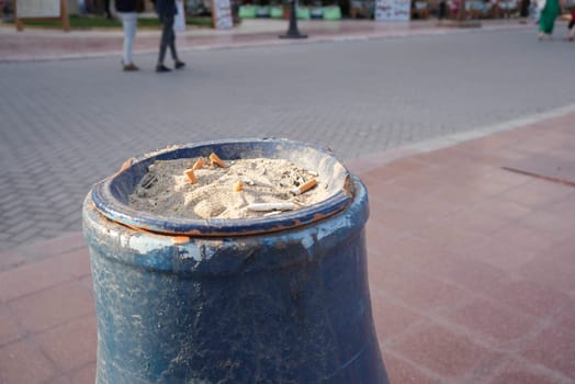Cigarette butt disposal urn in the street. High quality photo