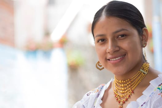 copy space of native from ecuador in the amazon looking at camera and smiling with earrings from her ethnic culture. High quality photo