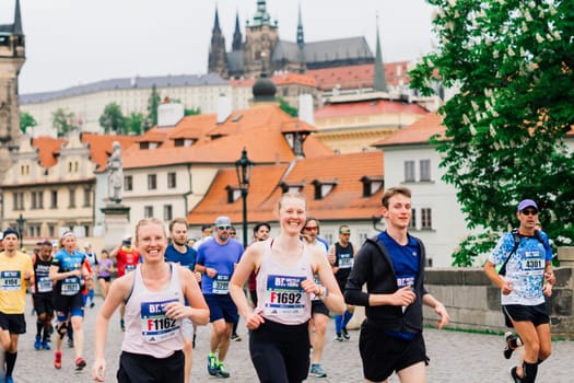 Prague, Czechia - 7th May 2023 - Group athletes runners run marathon in a sunlight