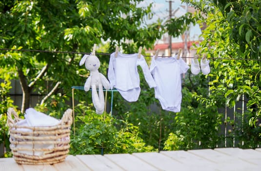 washing baby clothes. Linen dries in the fresh air. Selective focus. nature.