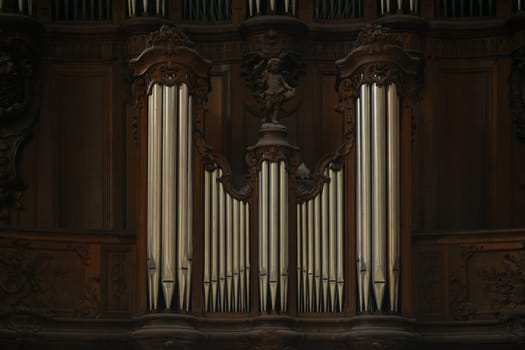 The organ in the church and the carved old wooden around