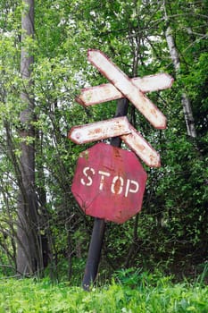 Sign STOP for train. An abandoned old railway in the middle of the forest