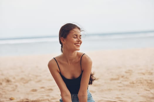 woman hair travel vacation attractive smile beach fashion sea nature female ocean sitting pretty freedom sand outdoor happy adult relax natural