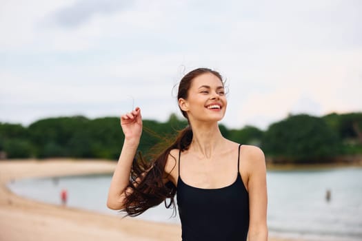 woman running nature beach positive smile beauty tan happiness flight carefree travel young sunset sexy smiling sea summer lifestyle active shore