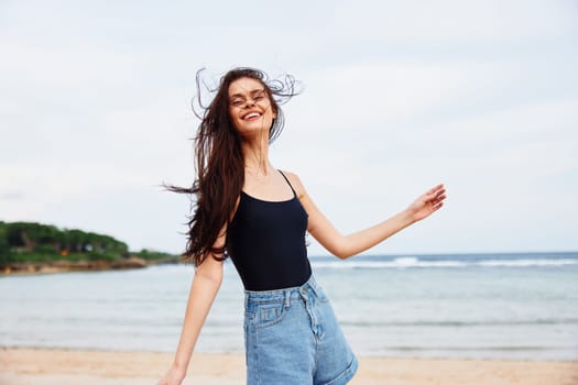 flight woman happy ocean fun sunset running smiling positive sexy smile beach beautiful relax sea freedom wave travel young summer lifestyle