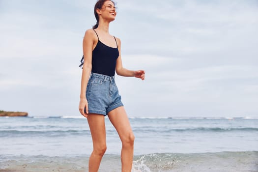 young woman smiling running lifestyle beach summer sea relax person girl fun smile beauty leisure sunset sun travel female sand flight