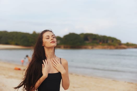 beach woman summer outdoor free sea lifestyle water beauty vacation ocean carefree enjoyment travel holiday smile sun sand sunset happy peaceful