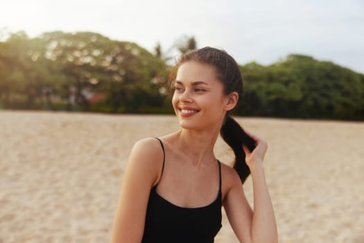 woman sunset smile summer travel ocean space copy-space outdoor walking beach happy young vacation nature copy coast sand happiness lifestyle female sea