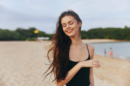 ocean woman summer outdoor smile sea tropical beautiful sand beach sunset peaceful running jean leisure female vacation lifestyle carefree free coast