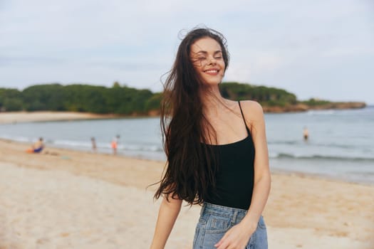 woman relax nature carefree water lifestyle leisure sea sand young summer ocean beauty smile sunset beautiful sky vacation beach coast outdoor