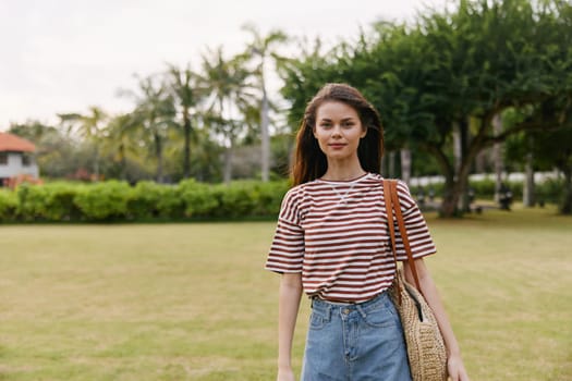 woman t-shirt happy beautiful smiling park active relax bag quiet lifestyle sun walk grass person natural summer nature smile hat freedom