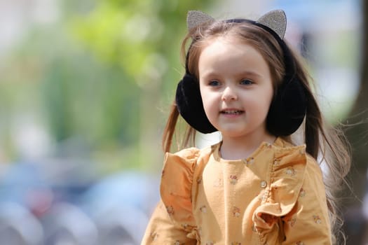 Portrait of a cute little girl in the park.