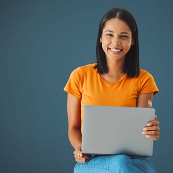 Laptop, woman and smile in portrait with mockup space, communication and technology isolated on studio background. Email, blog and copywriting with writer, happy person and connectivity with website.