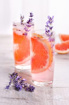 A cocktail of grapefruit and lavender paired with tequila, full of bright citrus aromas and fragrant herbs, showcasing the best fruits of the season.