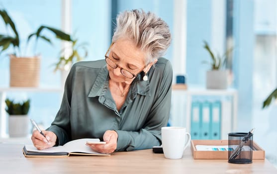 Writing, notebook and schedule with a woman ceo, manager or boss checking her diary for an appointment. Calendar, coffee and notes with a senior female employee using a pen to write in her planner.