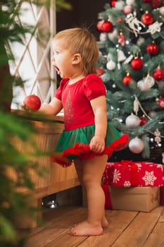 surprised Beautiful child who sees santa claus in the window.