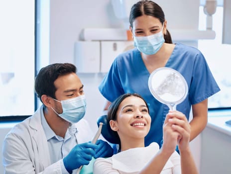 Dentist, mirror and woman check teeth after whitening, braces and dental consultation. Healthcare, dentistry and happy female patient smile with orthodontist for oral hygiene, wellness and cleaning.