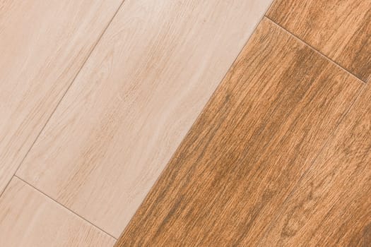 Wooden two color coating abstract pattern light and orange brown board background floor texture laminate flooring plank timber.