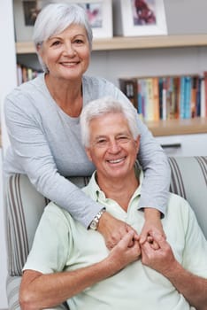 Happy senior couple, portrait and hug for love, romance or embrace in relationship or marriage together at home. Elderly woman hugging man with smile for loving, care and bonding in retirement.