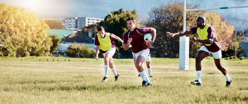 Rugby, athlete on field and sport game with men, team and player with ball, fitness and active outdoor. Exercise, sports training and running, teamwork with competition and action with energy.