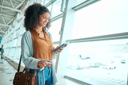 Black woman at airport, travel with smartphone and flight, communication and check social media with smile. Notification, email or chat with tech, ready with plane ticket and happy for adventure.