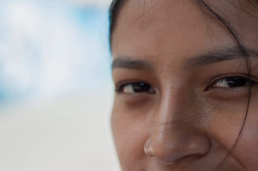 copy space of a detail shot of the eyes and nose of a pretty indigenous woman. High quality photo