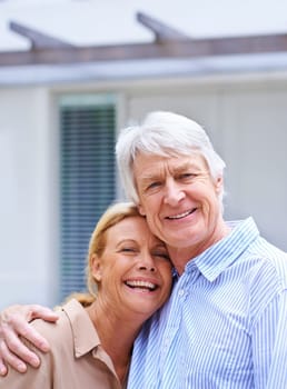 Enjoying love until the end. Portrait of an happy senior couple standing outdoors